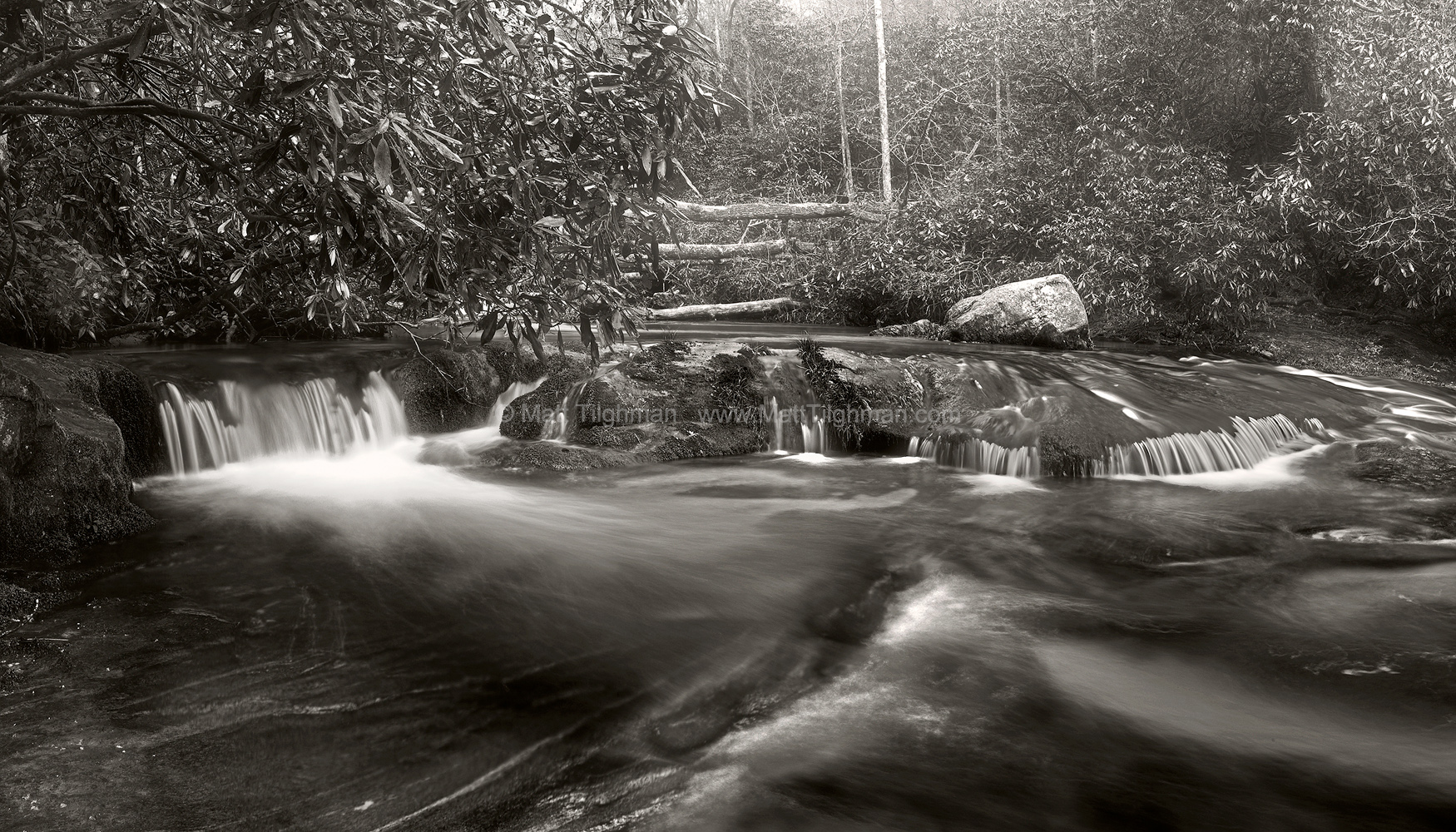 Chattooga River Rapids In Winter Mist Fine art stock photograph of Chattooga River rapids in North Carolina. The frigid river mixes with Spring's warming air, shrouding the landscape in fog and mist.