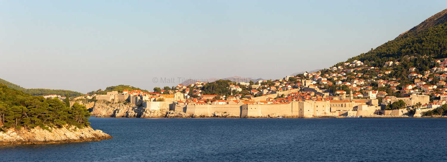Fine art stock photograph from Croatia's Dalmatian Coast. Looking at Dubrovnik from the sea, almost the entire city is obscured by its massive walls.