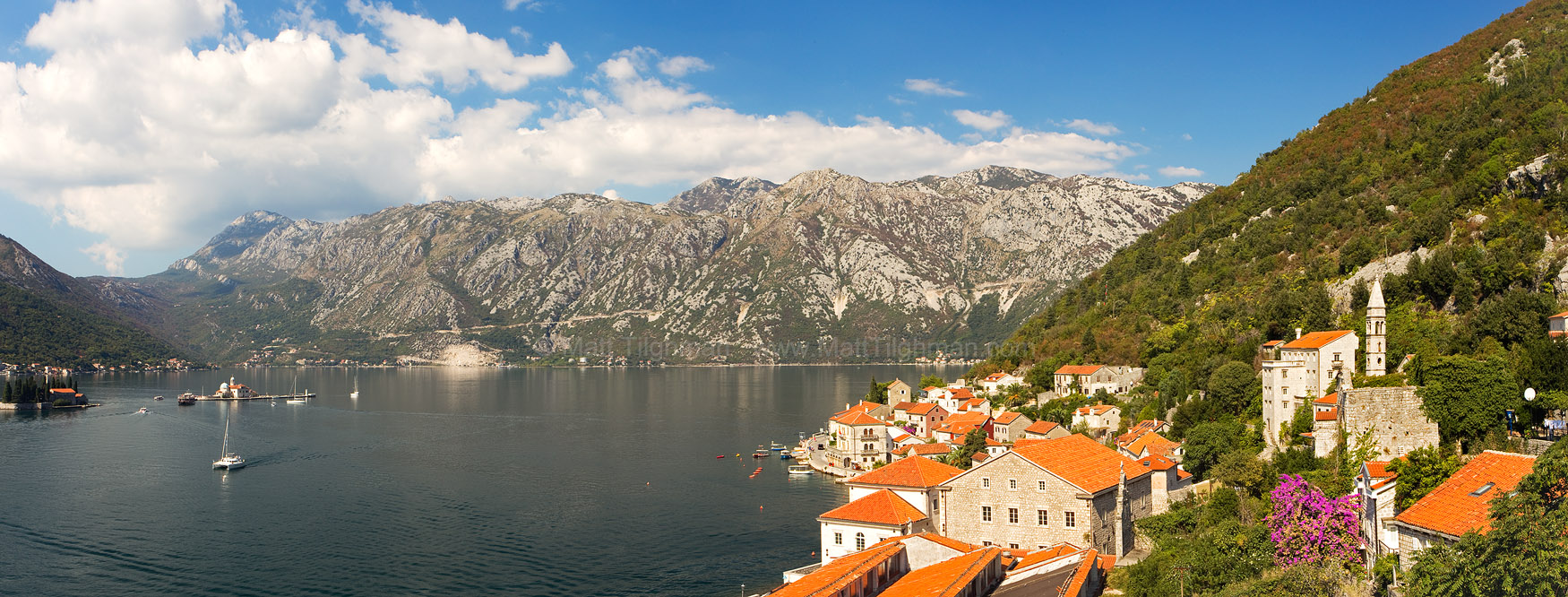 Dinaric Alps and Kotor Bay Fine art stock landscape photograph from Perast, Montenegro. From high up the bell tower, the panoramic vista of the Dinaric Alps and Kotor Bay is sublime.