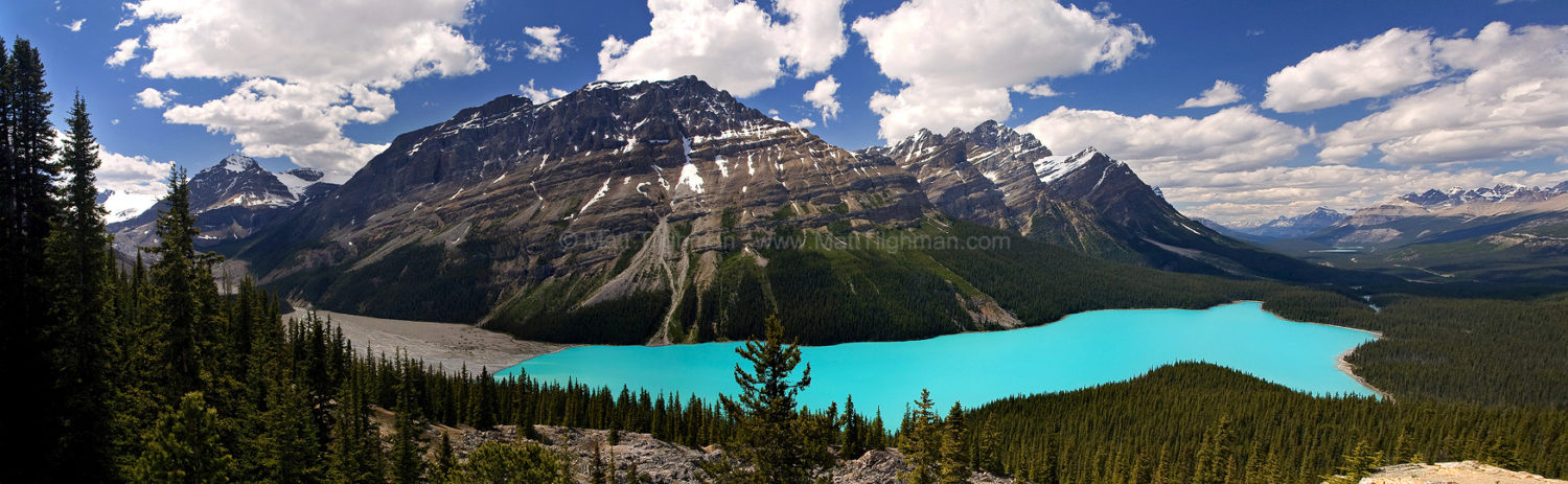 Fine art stock landscape photograph of Peyto Lake, in Banff National Park, Canada. The blue glacially-fed lake is flanked by the towering Rocky Mountains.