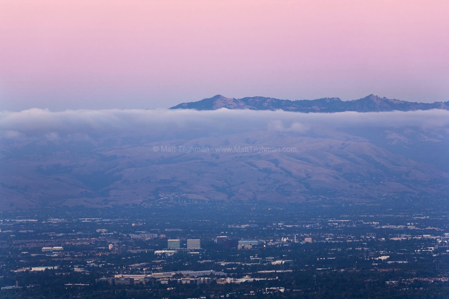 Fine art stock landscape photograph from California's Silicon Valley. Seen at dusk, the towering Diablo Range puts bustling life in the valley into perspective.