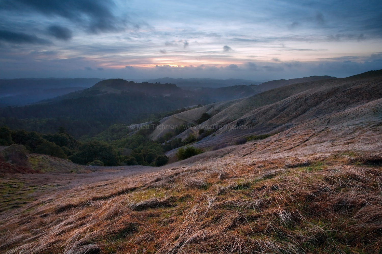 Fine art stock photograph of a cold California winter storm approaching Russian Ridge Open Space at Sunset, in the Santa Cruz Mountains.