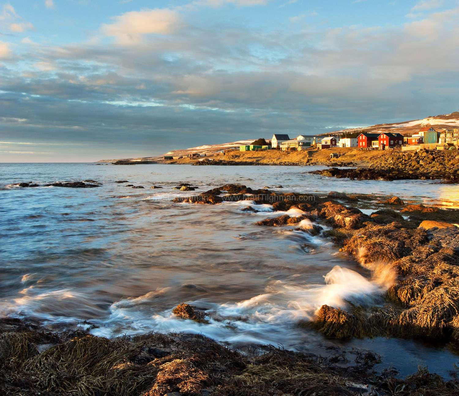 Fine art stock photograph from northern Iceland, in the small town of Hvammstangi. As the sun sets, the small waterfront shows its charm.
