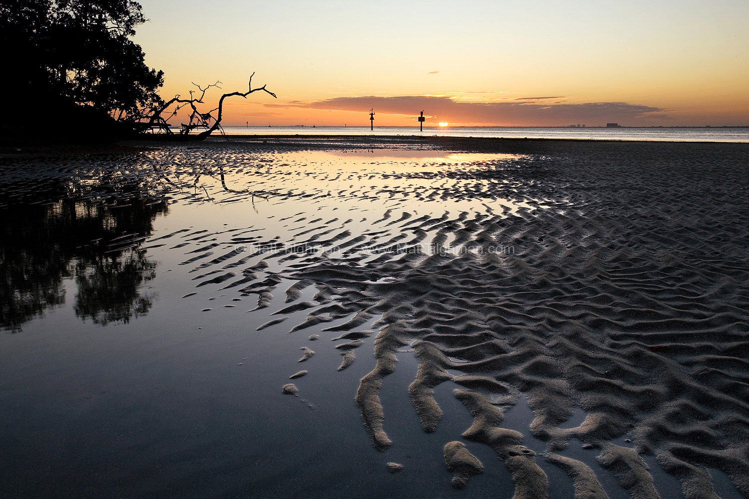 Fine art stock photograph of the Biscayne Bay, Florida, at low tide. As the sun sets over the bay, just outside of Miami, civilization feels worlds away.
