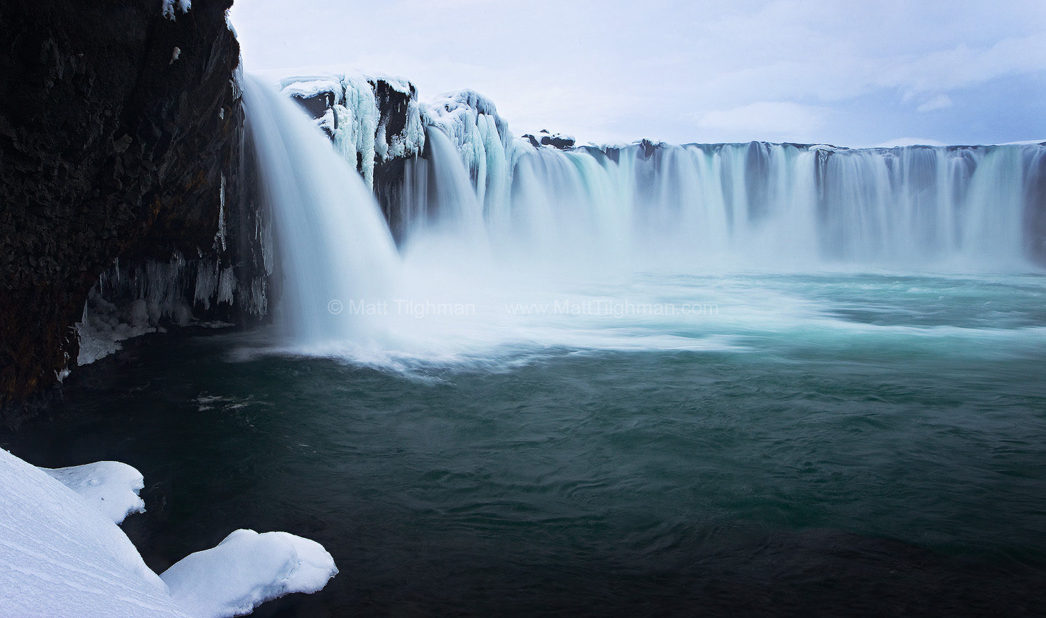 Fine art stock photograph of Godafoss, Iceland. Winter brings a beautiful fantasy-like landscape to this iconic waterfall. It also helps keep away the tourists.