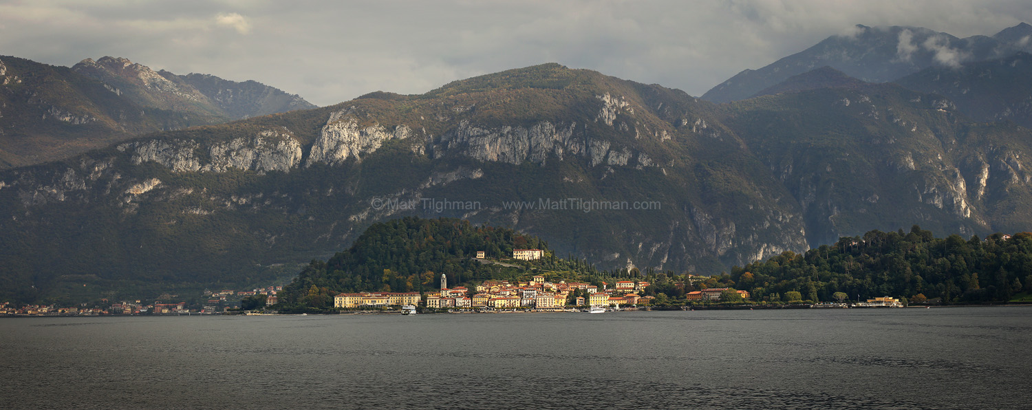 Golden Rays over Bellagio - Lake Como Italy Fine art stock photograph of Bellagio, on Lake Como Italy. A brief ray of sunshine breaks through the overcase sky, bathing the ancient city in beautiful gold.